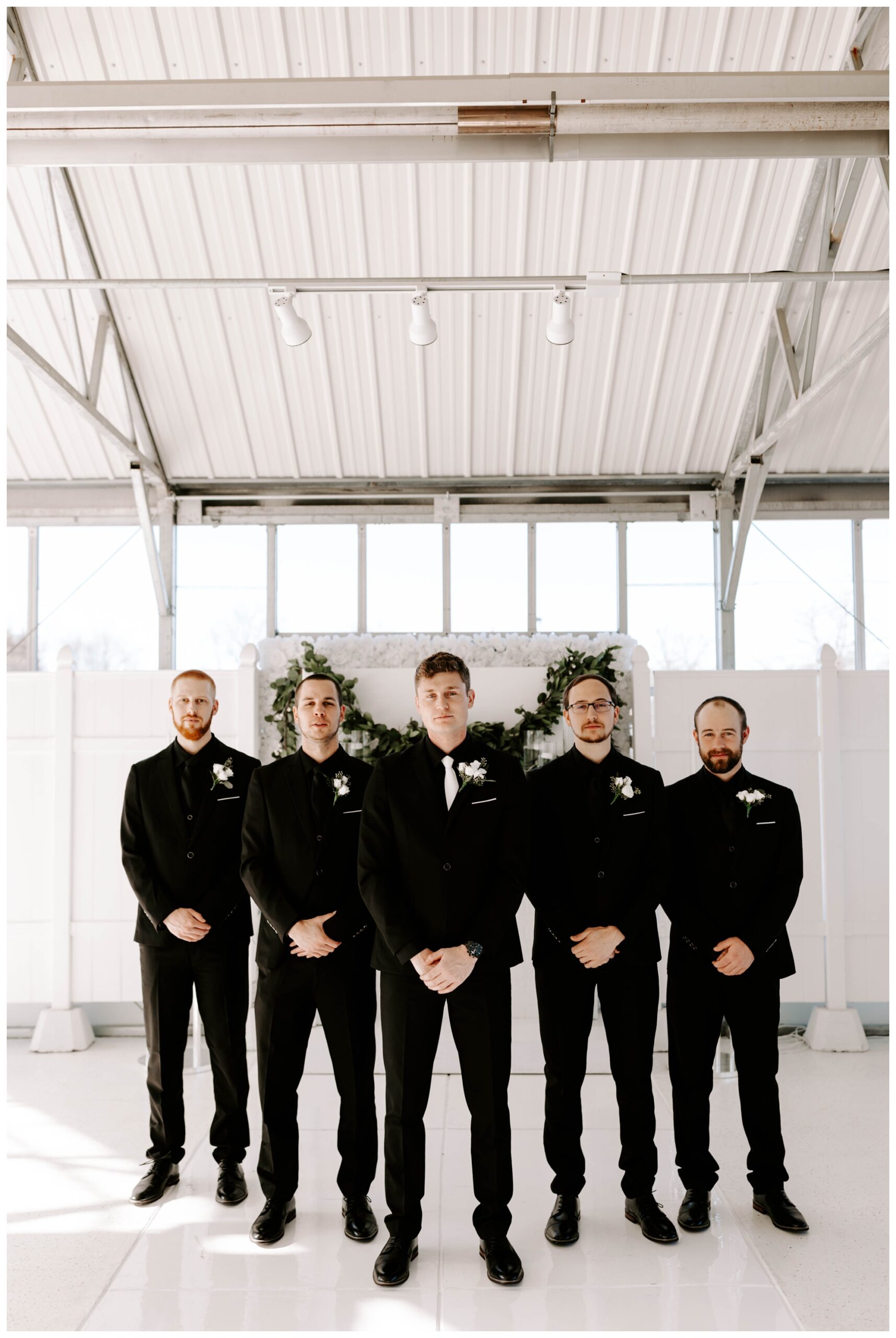 black and white groomsmen suits