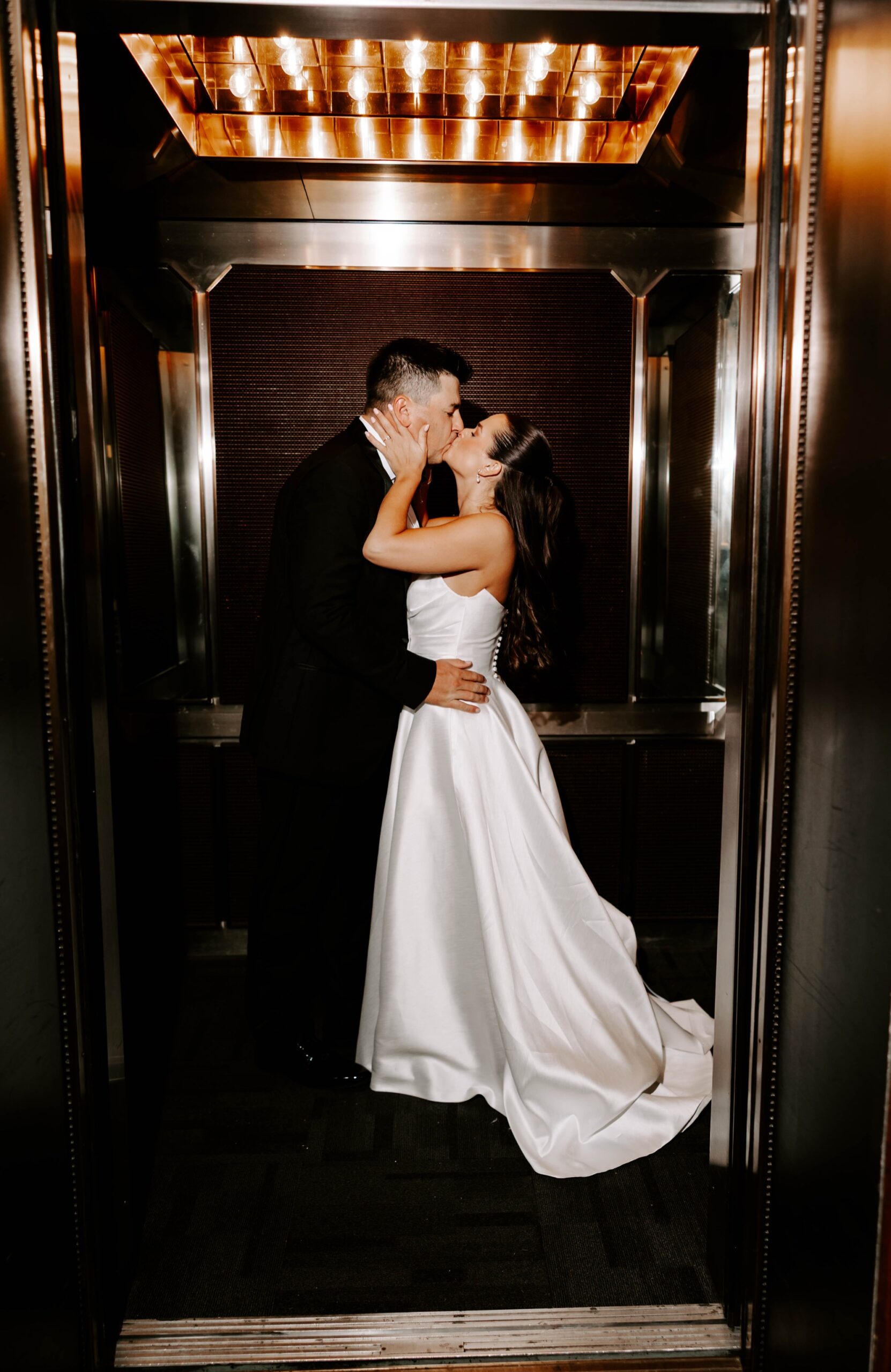 elevator kiss for wedding photography