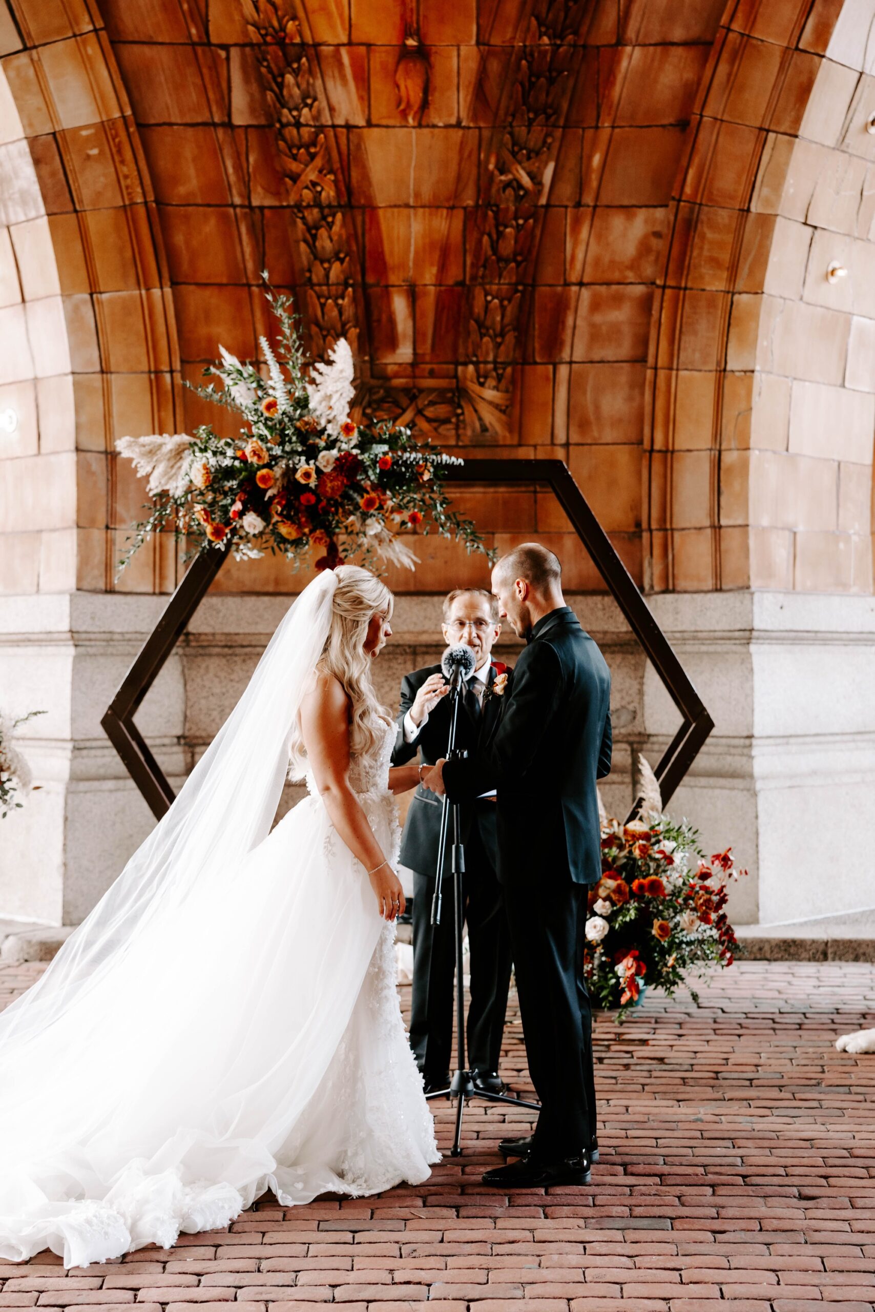 outdoor fall wedding ceremony beneath the dome at the Pennsylvanian; wedding ceremony at The Rotunda, Pittsburgh