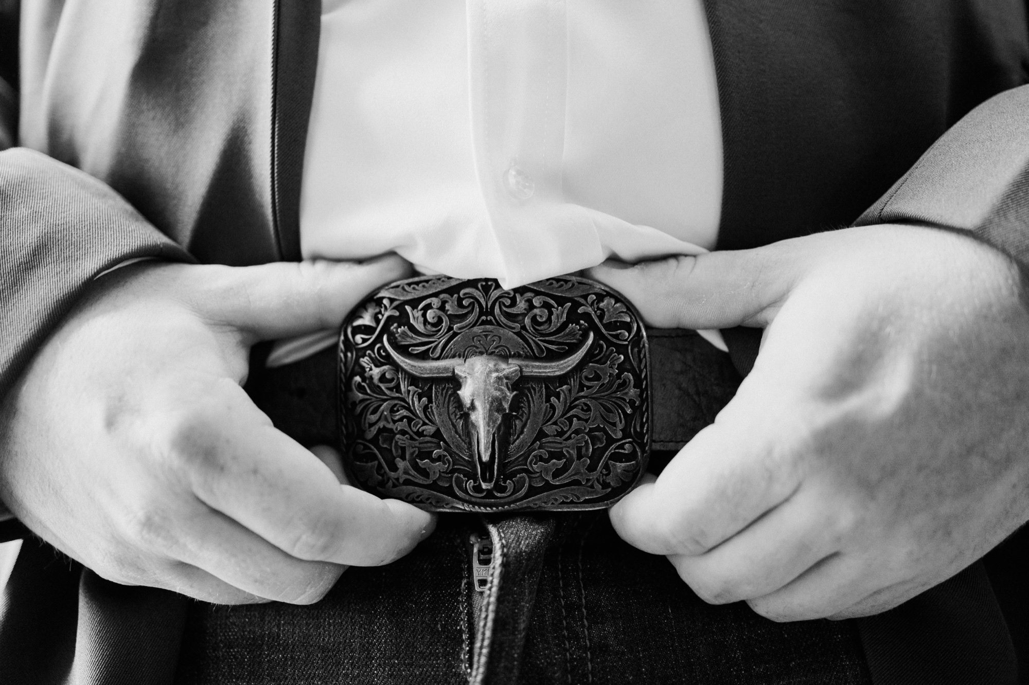Western wear for grooms; belt buckle and bolo tie for groom