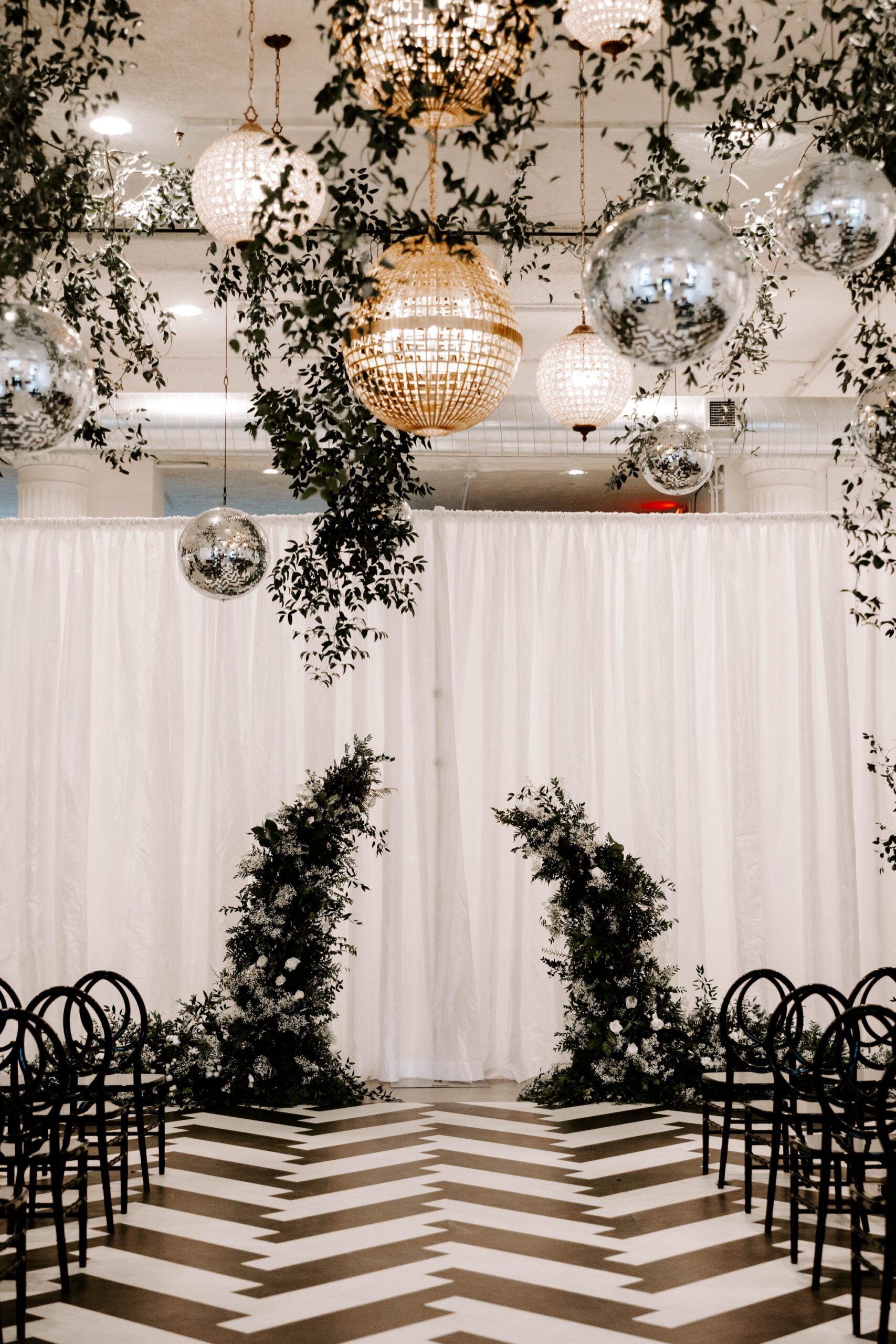 how to style a blank canvas venue; black and white winter wedding with disco balls at Franklin on Penn Pittsburgh wedding venue