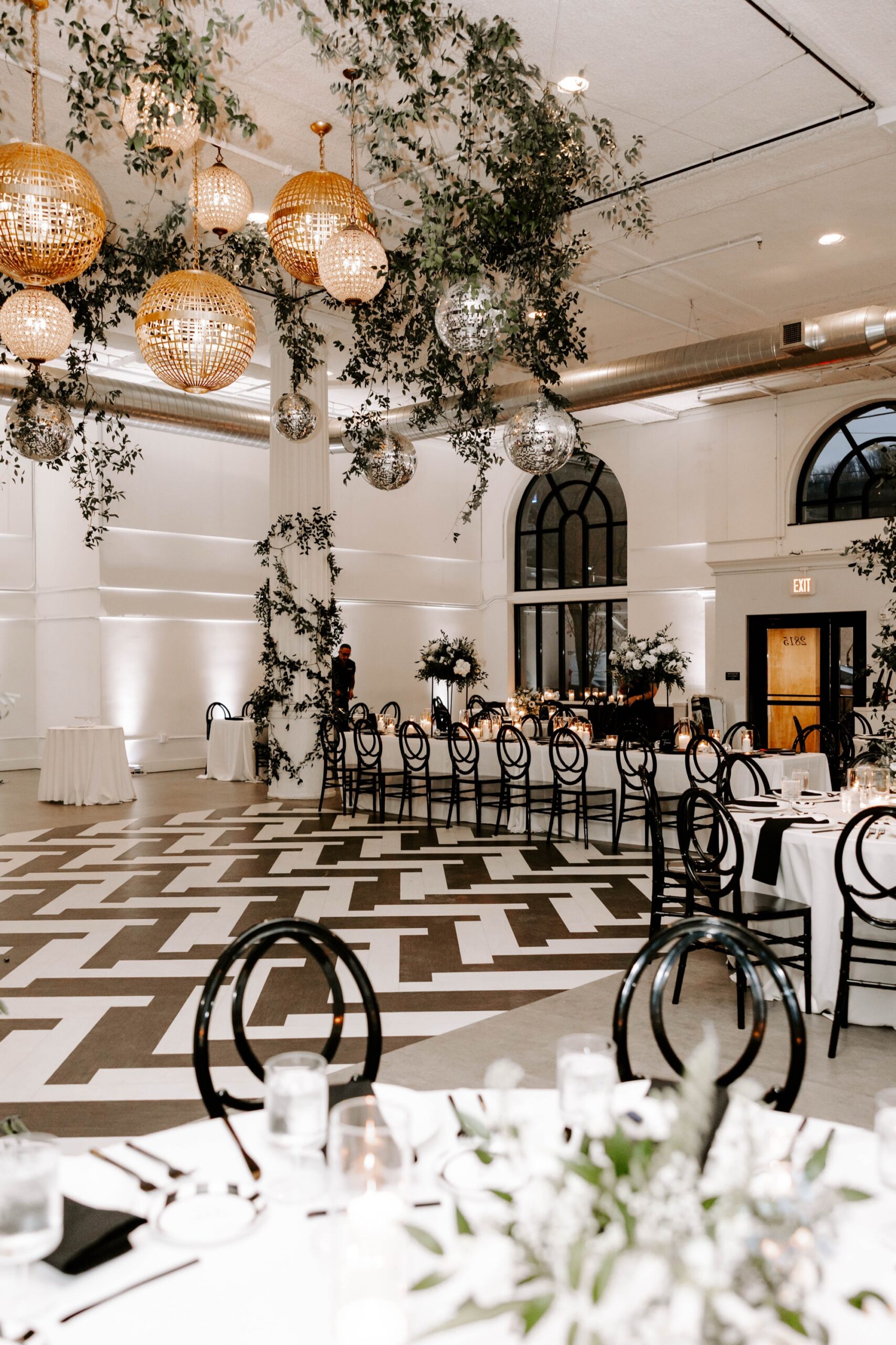 how to style a blank canvas venue; black and white winter wedding with disco balls at Franklin on Penn Pittsburgh wedding venue