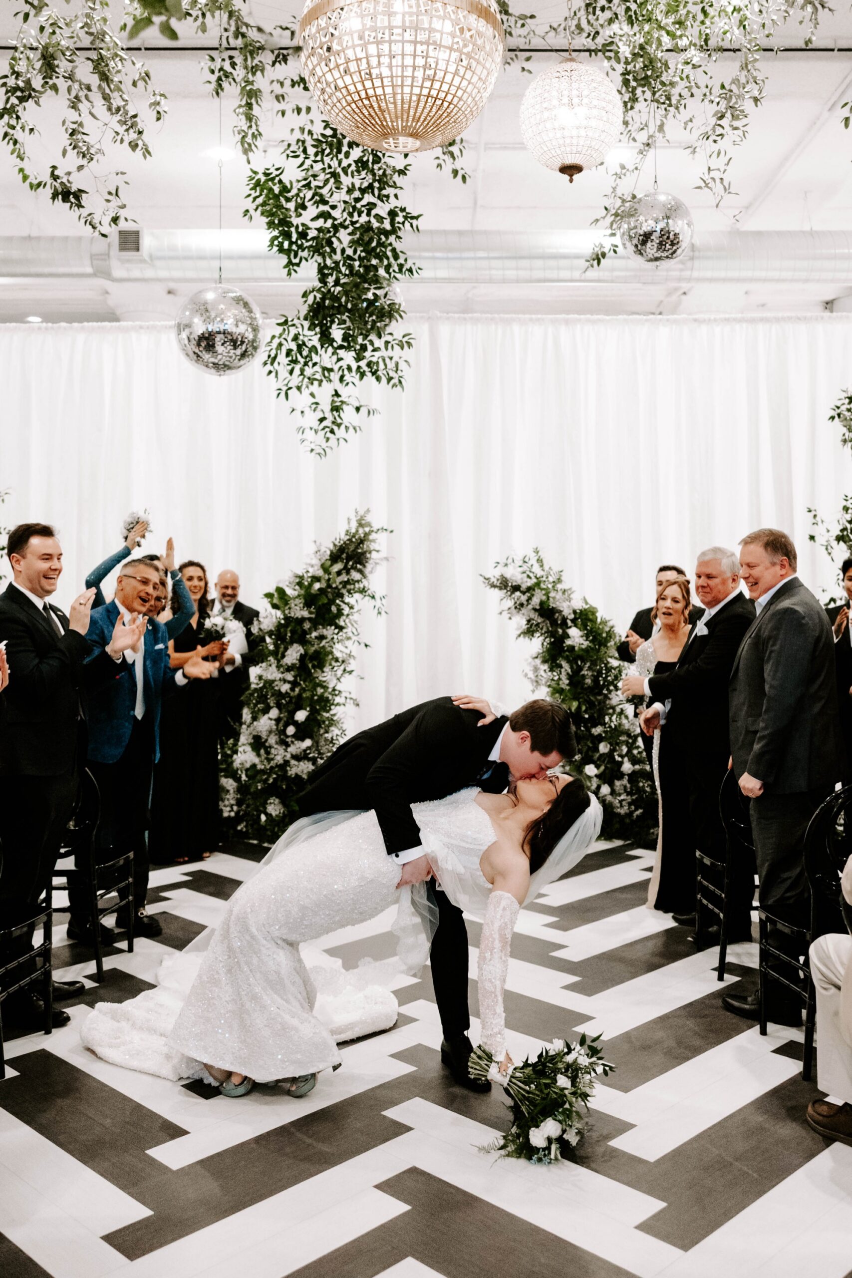 aisle dip kiss wedding photos