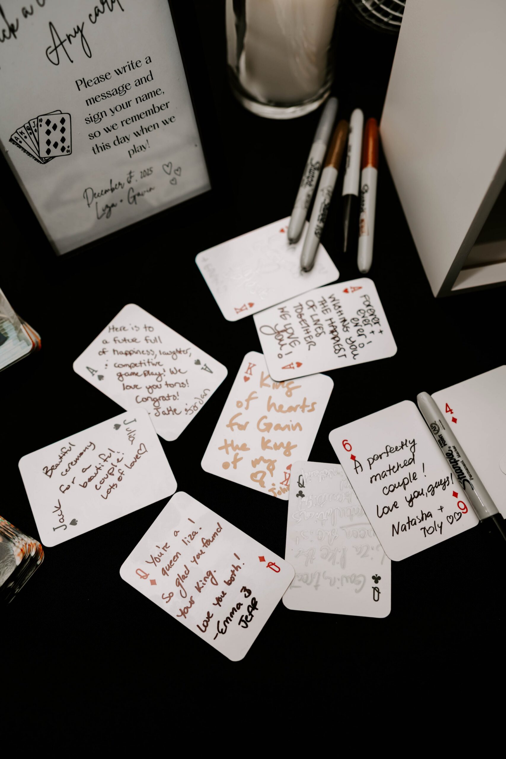 fun ideas for guestbook; guests sign notes on a deck of playing cards for wedding; Queen of Hearts wedding