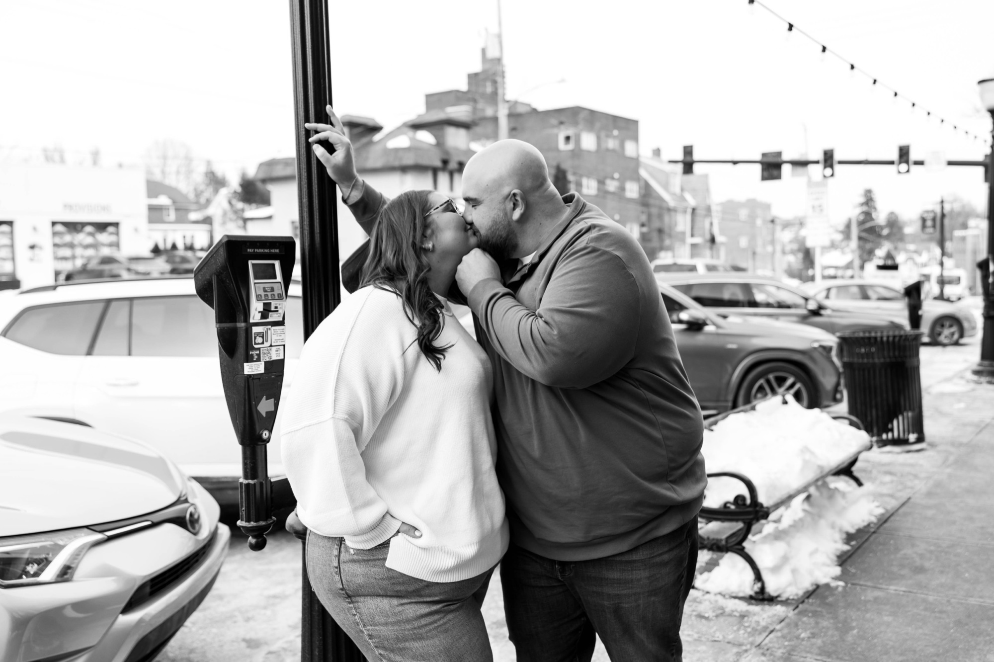 black and white engagement photos of couple kissing