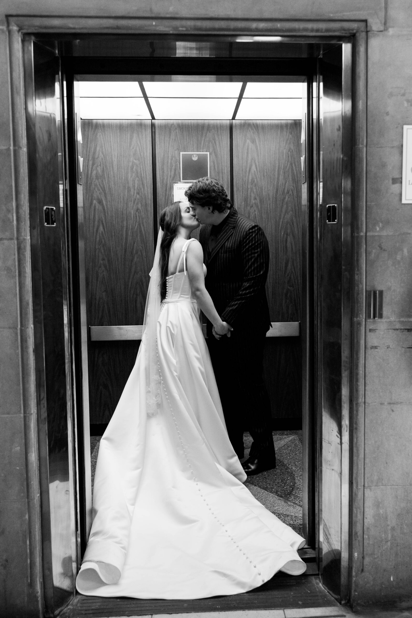 elevator kiss wedding photography