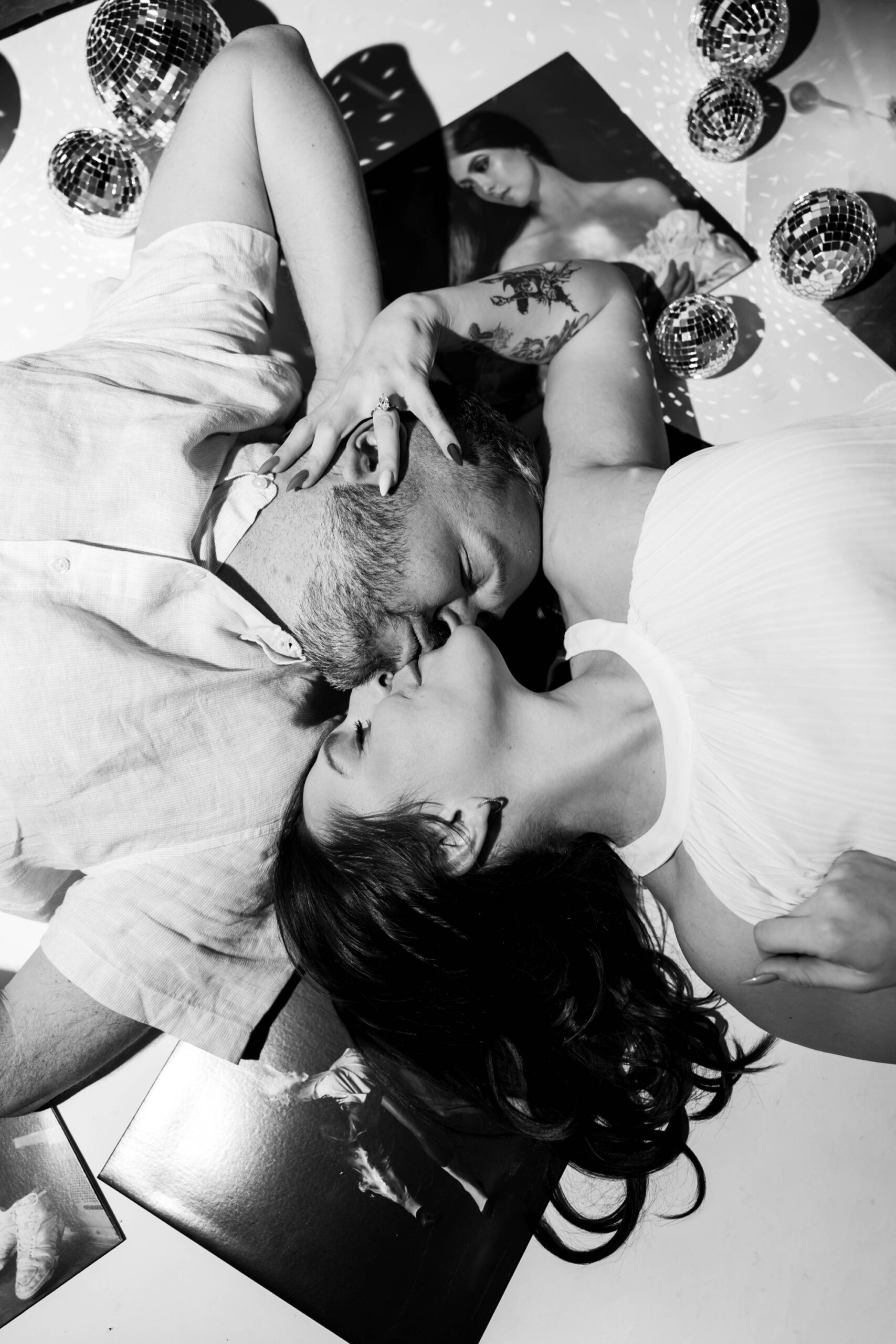 vinyl records, disco balls, and vintage-style cake for "just engaged" photo session