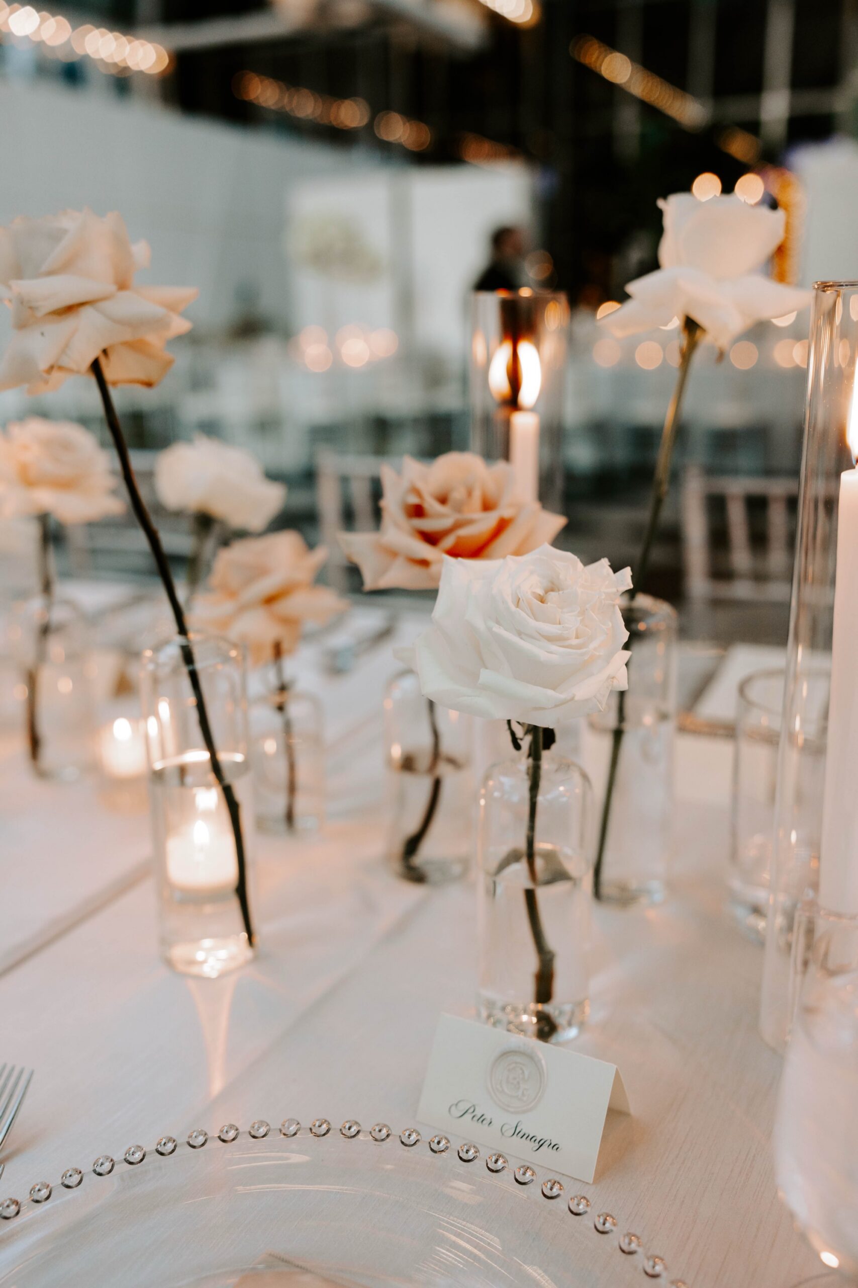 single stem roses in vases for wedding reception
