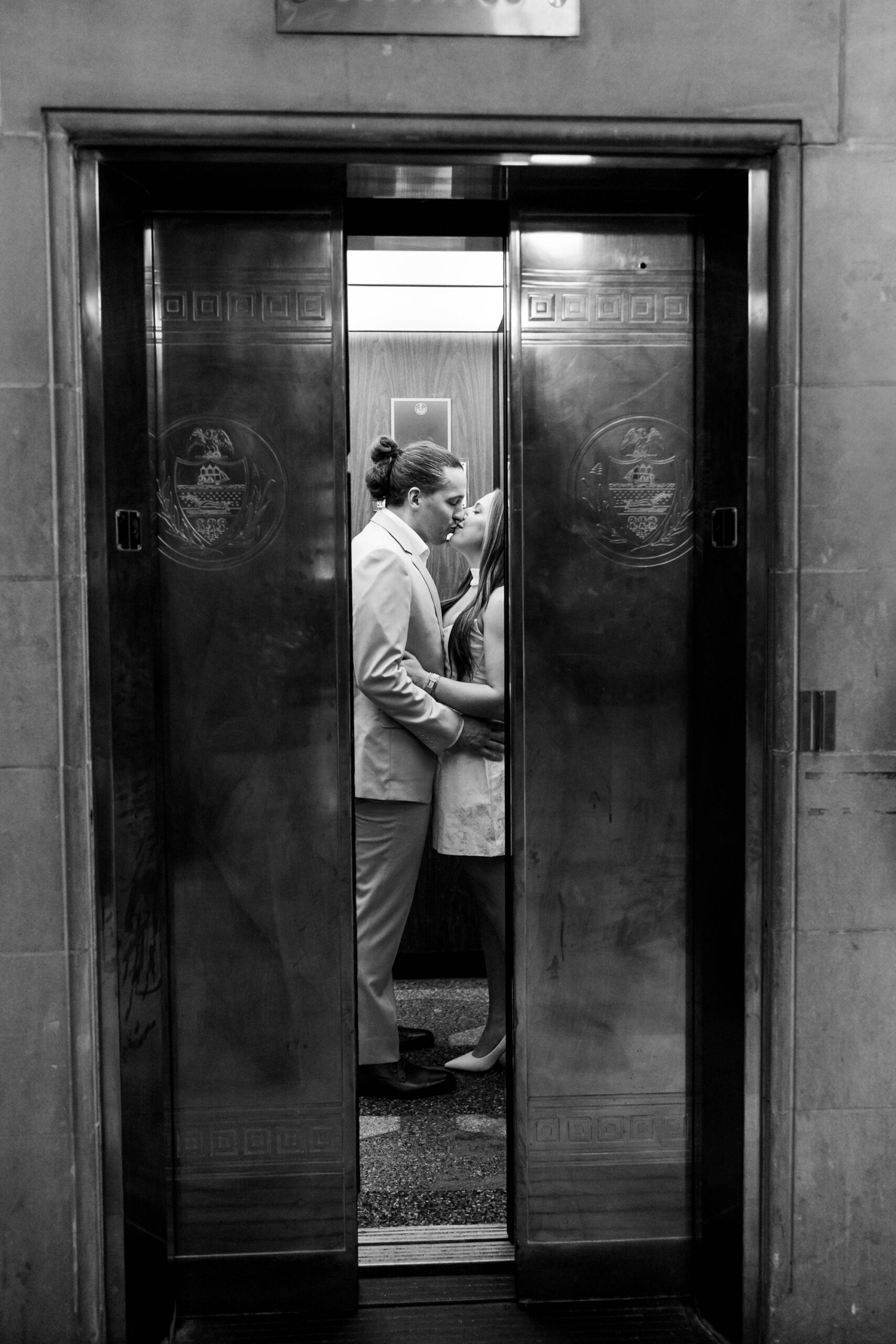 intimate black and white elevator shot for engagement portraits
