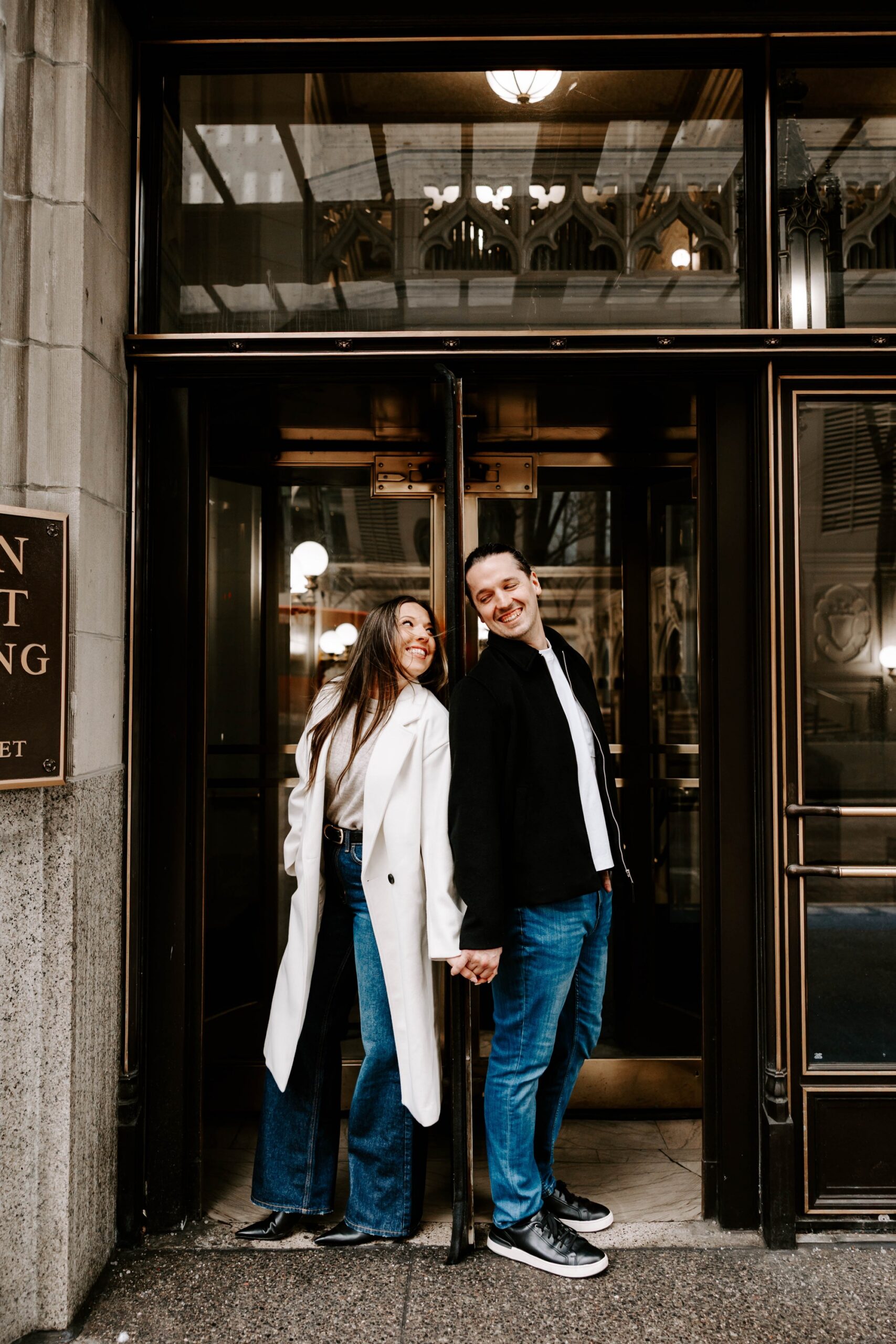 revolving door photo ideas for engagement session